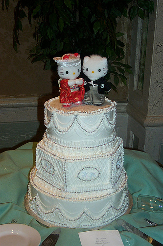 Beautiful Hello Kitty wedding cake topper. Figurines are hand-made in cold